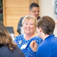 Alumni smiling at the event.